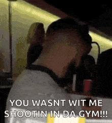 a man wearing headphones says you wasnt wit me shootin in da gym !!!