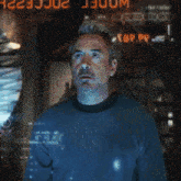 a man is standing in front of a screen that says " wonder " on it