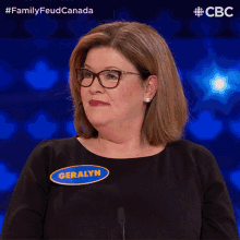 a woman wearing glasses and a name tag that says geralyn