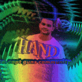 a man wearing a rainbow shirt that says hand on it