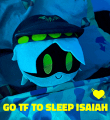 a stuffed animal is laying on a bed with the words " go tf to sleep isaiah " above it