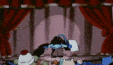 a group of cartoon characters are standing on a stage with red curtains behind them