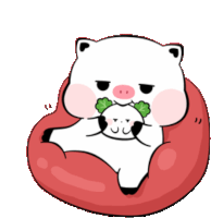 a cartoon pig is sitting on a red bean bag chair eating a leaf