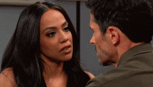 a man and a woman are looking at each other with their eyes closed