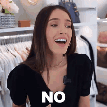 a woman wearing a black shirt says no