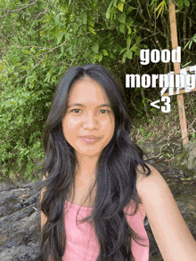 a woman in a pink top says good morning