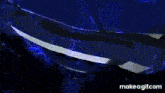 a blue spinning top with a dragon on it is spinning in the dark .