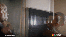 a nbc advertisement shows a man shaving his beard