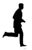 a silhouette of a man in a suit is running .