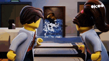 a man and a woman are standing next to each other in front of a door that says okoo