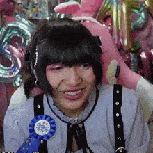 a girl is wearing a ribbon that says always boy