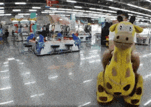 a person is riding a stuffed giraffe in a store