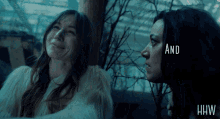two women are looking at each other with the words and hw visible