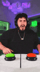 a man wearing headphones and a necklace that says majer