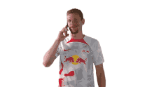 on a call marcel halstenberg rb leipzig in a phone call talking on the phone