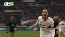 a soccer player wearing a jersey that says ninamax