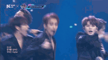 a group of young men are performing on a stage with the words seventeen on the bottom