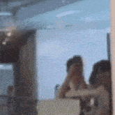 a blurry picture of a person taking a picture of themselves in the mirror .