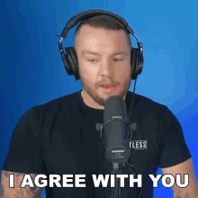 a man with headphones and a microphone says i agree with you
