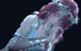 a woman with pink hair and a blue dress is sleeping with her eyes closed