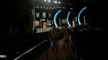 a man and a woman are dancing in front of a fox 11 advertisement