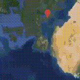 an aerial view of the earth with a red pin pointing to the middle east