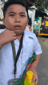 a boy with a lanyard around his neck that says ' philippines '