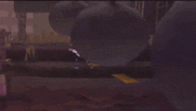 a person is flying through the air in a video game with purple lights coming out of their hands .