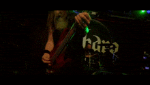 a man and a woman are playing guitars on a stage