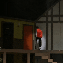 a person in a red hoodie is standing in front of a door that has a sign on it that says toilet