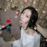 a woman is holding a stuffed reindeer with hearts around her and the words myre loves haseul 3 on the bottom