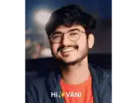 a man wearing glasses and a red shirt with the name hi vani on the bottom