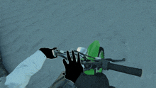a person wearing black gloves is riding a snowmobile