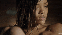 a close up of a woman 's face with vevo in the corner