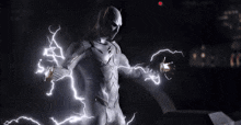 a man in a white superhero costume is surrounded by lightning