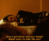 a person laying on a bed with the words " does it get better with your family " written above them