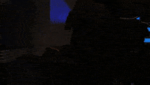 a dark room with a shadow of a person on the floor