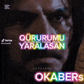 a close up of a man 's face with the words " okabers " written above him