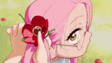 a girl with purple eyes is eating something with a spoon in her mouth