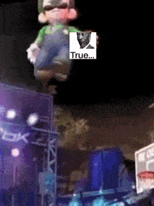 a cartoon character with a picture of a man and the word true on it