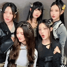 a group of young women are posing for a picture and one of them has the name jzfussie written on her shirt