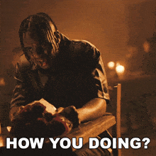 a man sitting at a table with the words how you doing written below him