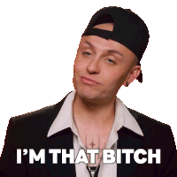 a man wearing a hat and a suit says " i 'm that bitch "