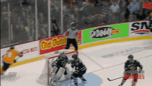 a hockey game is being played in front of a banner that says old dominion on it