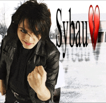 a man in a black leather jacket stands in front of sybau