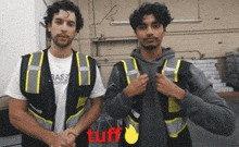 two men wearing reflective vests are shaking hands with the word tuff in red