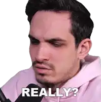 a man is wearing a pink hoodie and says really ?