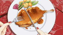 a person cutting a piece of meat with a knife and fork on a plate