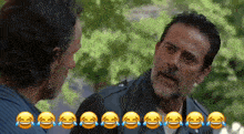 two men are laughing with tears coming down their eyes