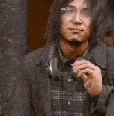 a man wearing glasses and headphones says " do n't worry yagami-shi it 's your welcoming par "